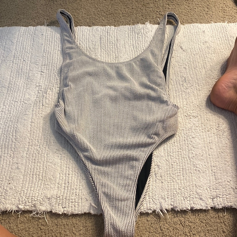 Ribbed once piece, figure fitting, thong bottom